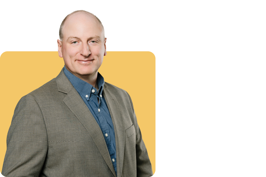 Photo of Adrian harguess on a yellow background