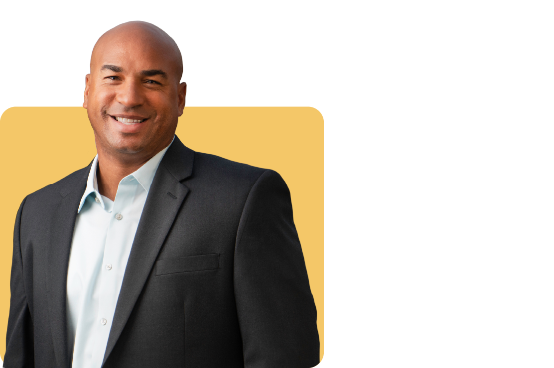 Photo of Anthony Tschache on a yellow background
