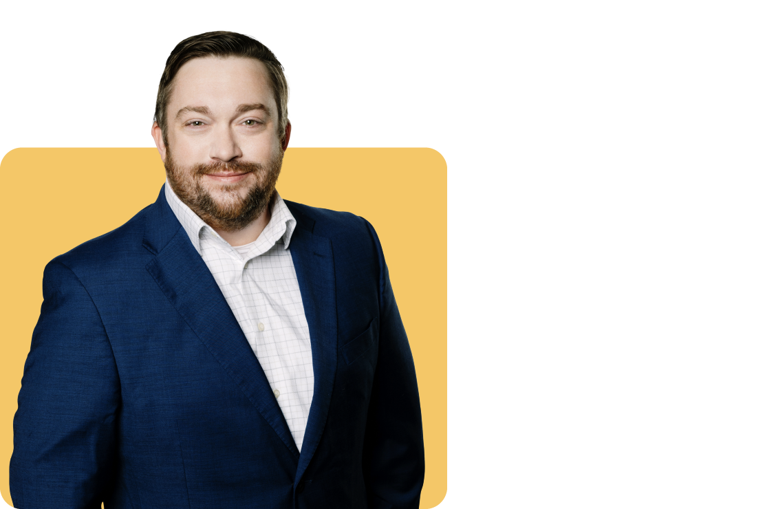 Photo of Brandon Wolking on a yellow background