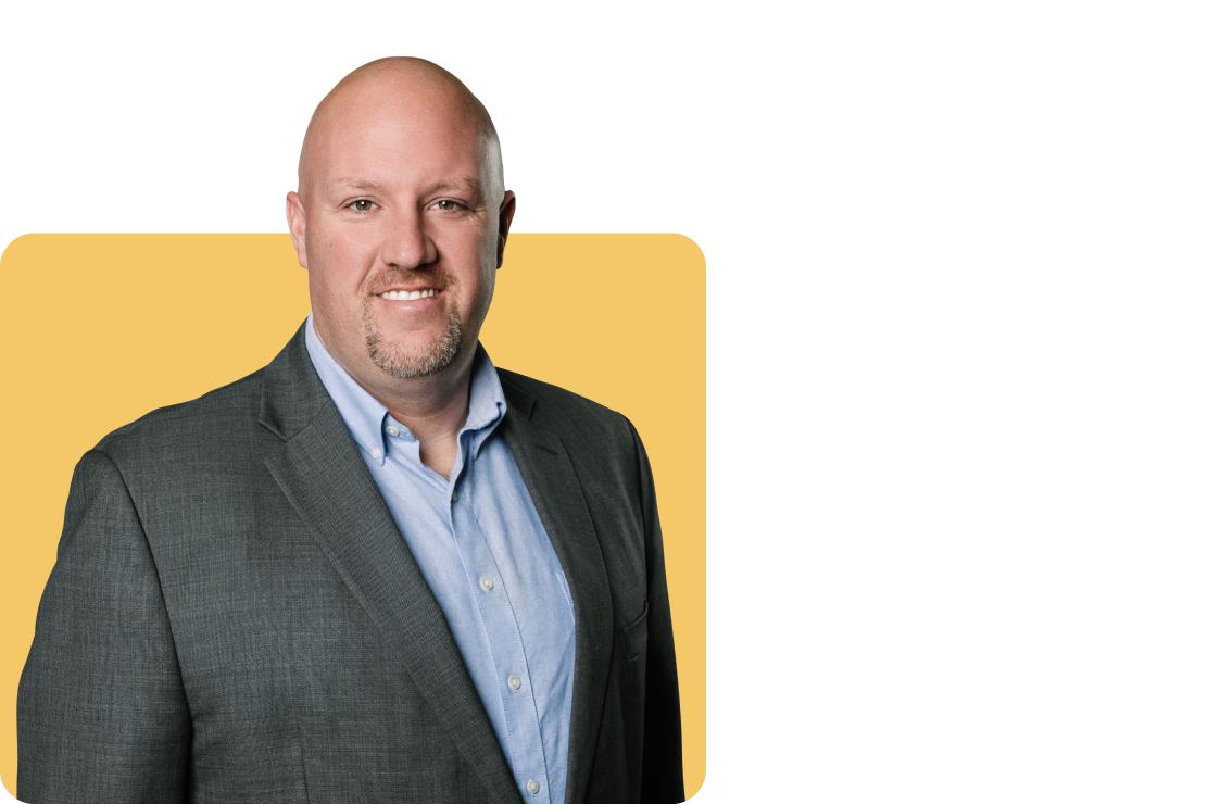 Photo of Casey Waddell on a yellow background