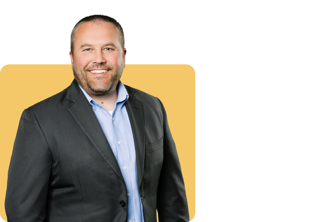 Photo of Kirk Amick on a yellow background