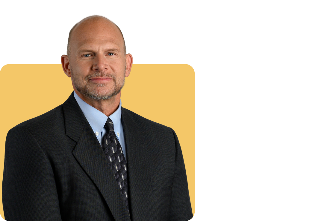 Photo of Kyle Koski on a yellow background