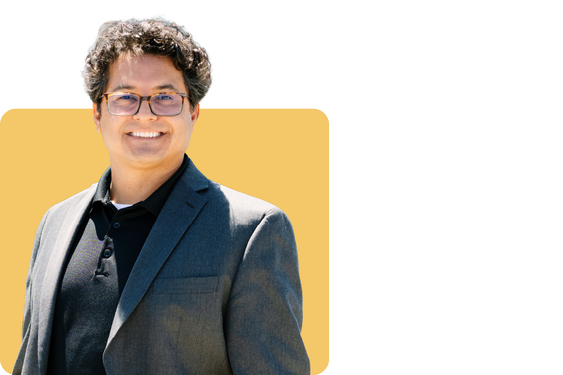 Photo of Rudy Mendoza on a yellow background