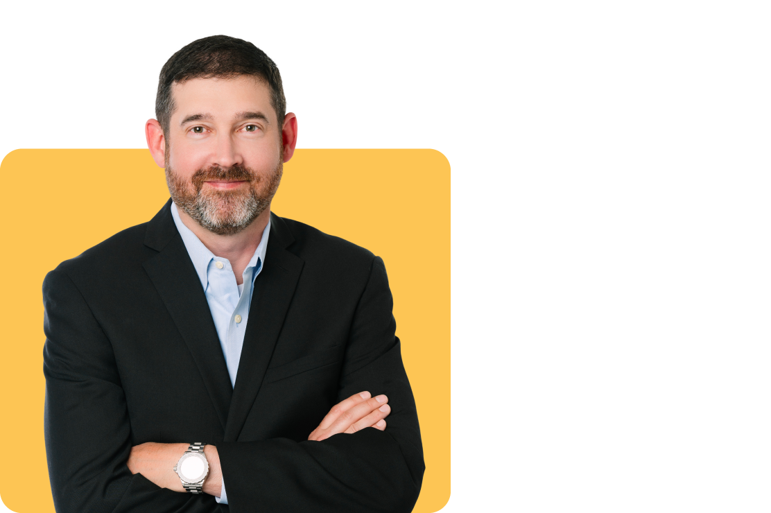 Photo of Ryan Levy on a yellow background