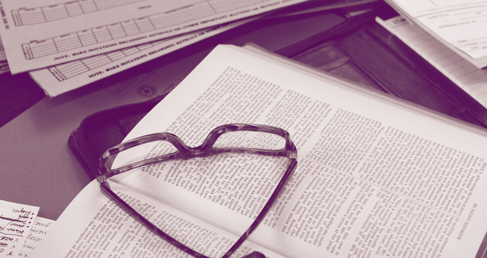 Photo of a pair of glasses on an open book