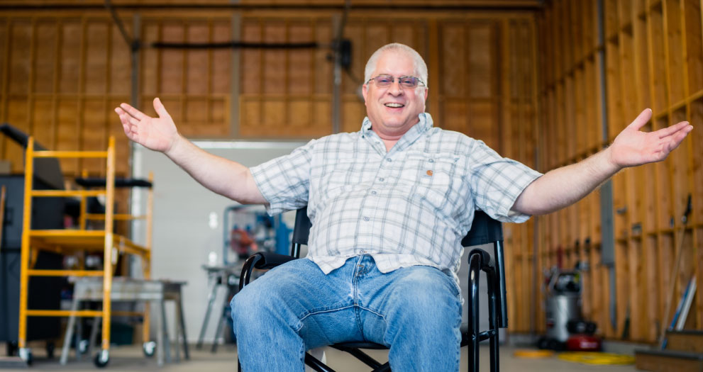 John Nordine sitting in his garage