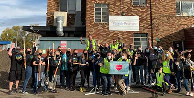 Employees volunteering at Family Promise in Spokane on International Credit Union Day.