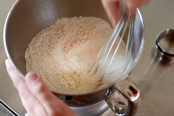 Photo of a stand mixer with flour in it