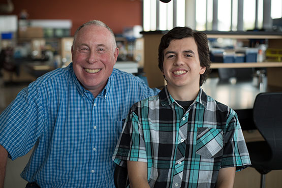 Photo of teacher Randy James and a student