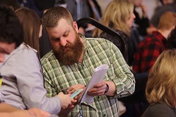 Photo of teacher Ryan Markel working with a student
