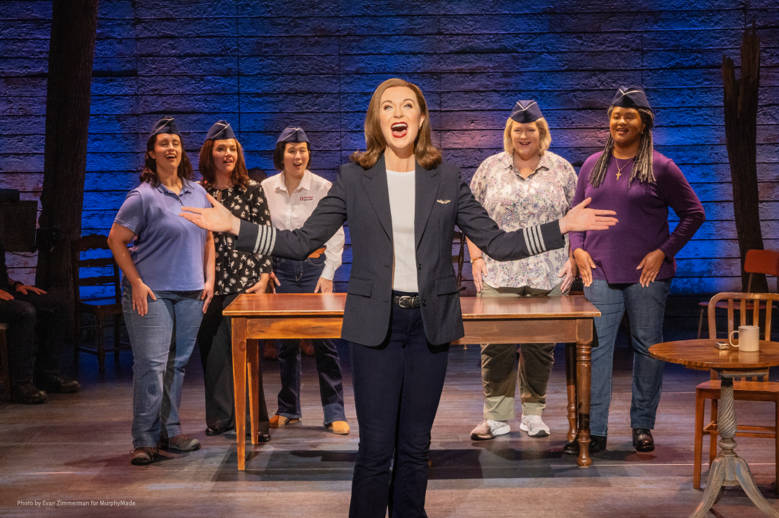 Photo of Come From Away cast on stage performing