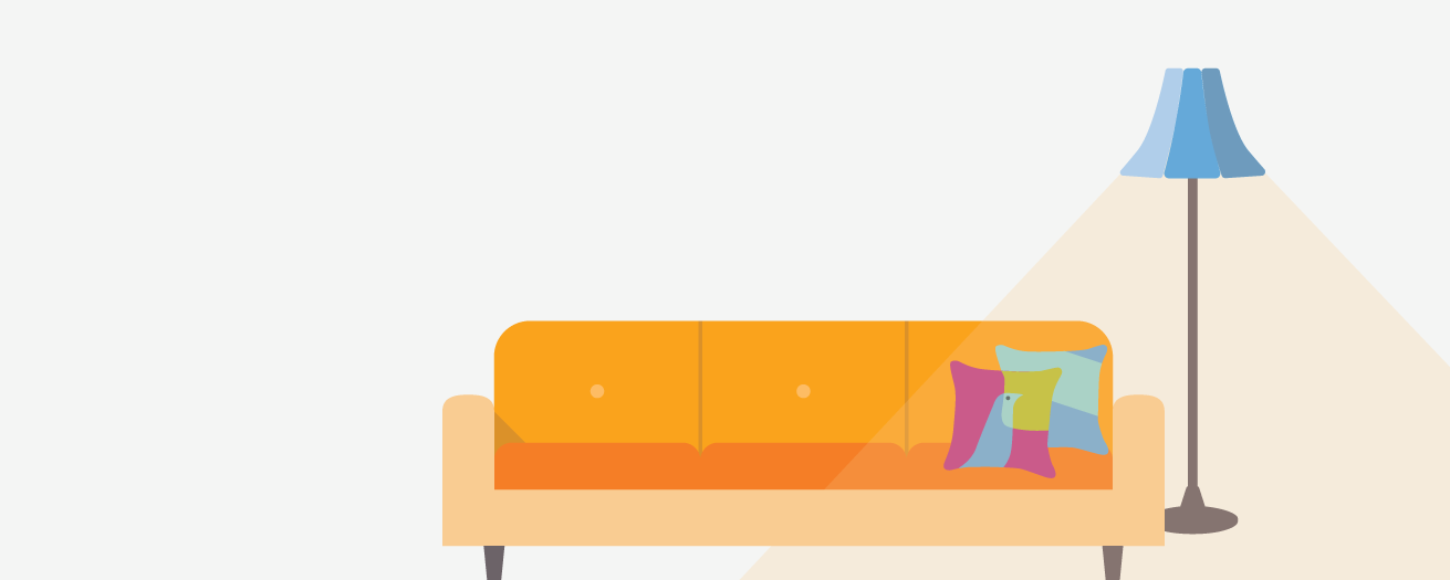 Orange couch, decorated with pillow; blue lamp