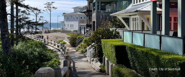 Photo of beach houses next to a walking path