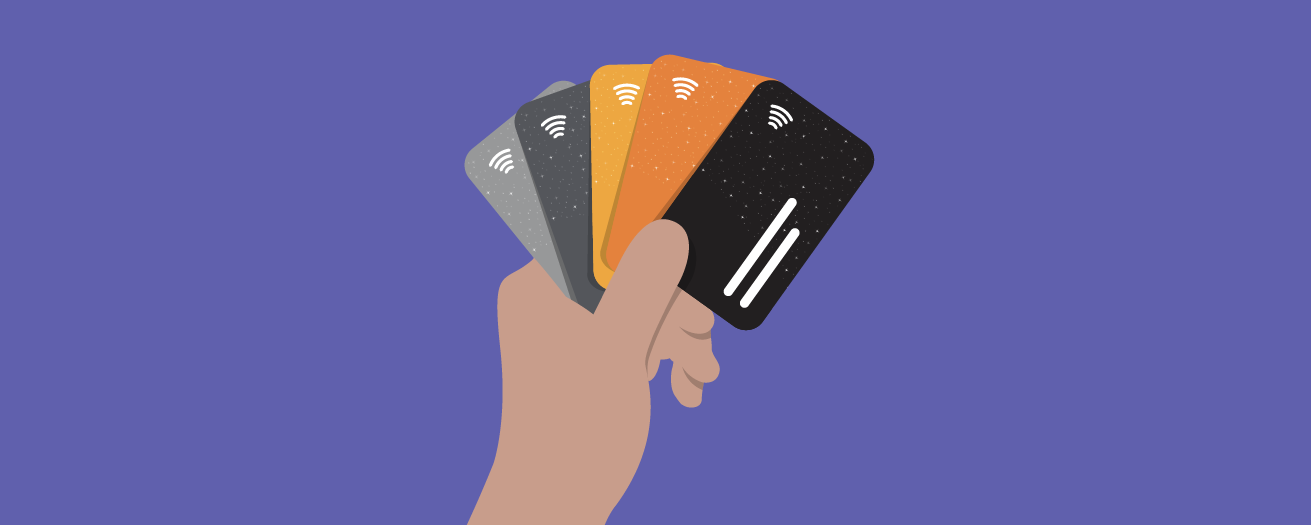 Illustration of a hand holding four diferent credit cards like playing cards
