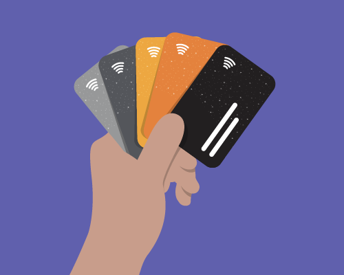 Illustration of a hand holding four diferent credit cards like playing cards