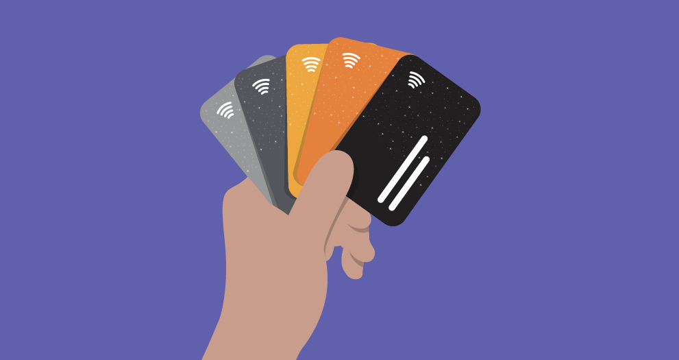 Illustration of a hand holding four diferent credit cards like playing cards