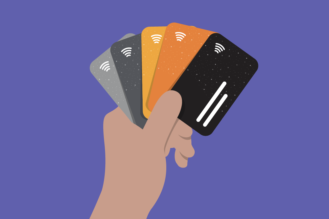 Illustration of a hand holding four diferent credit cards like playing cards