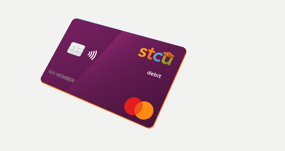 Photo illustration of a purple STCU debit card