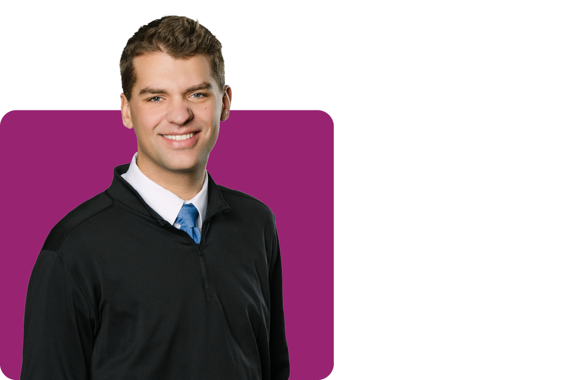 A photograph of Benjamin Schmidt on a purple background