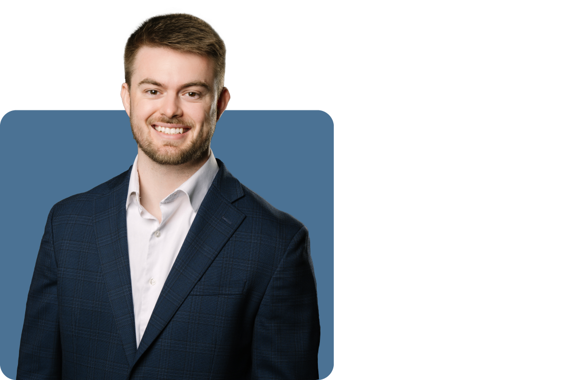 Headshot photo of Bryan Anderson set against a blue backdrop